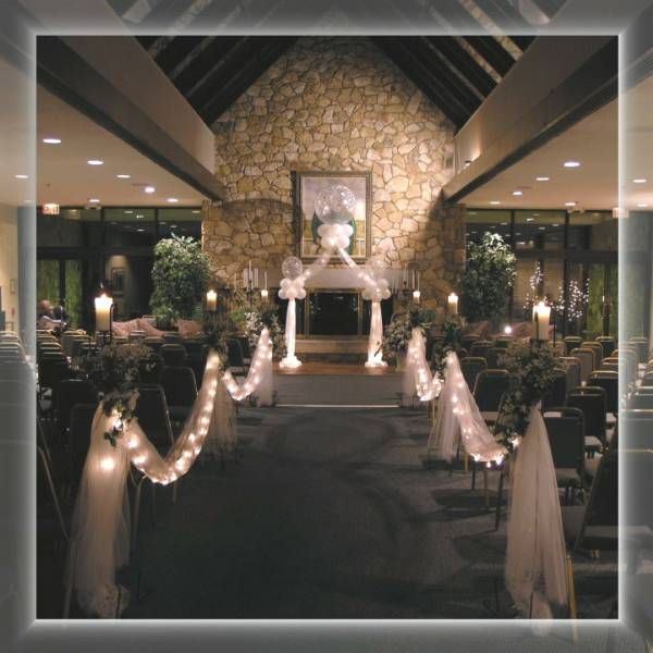 A picture of a church decorated for a wedding ceremony