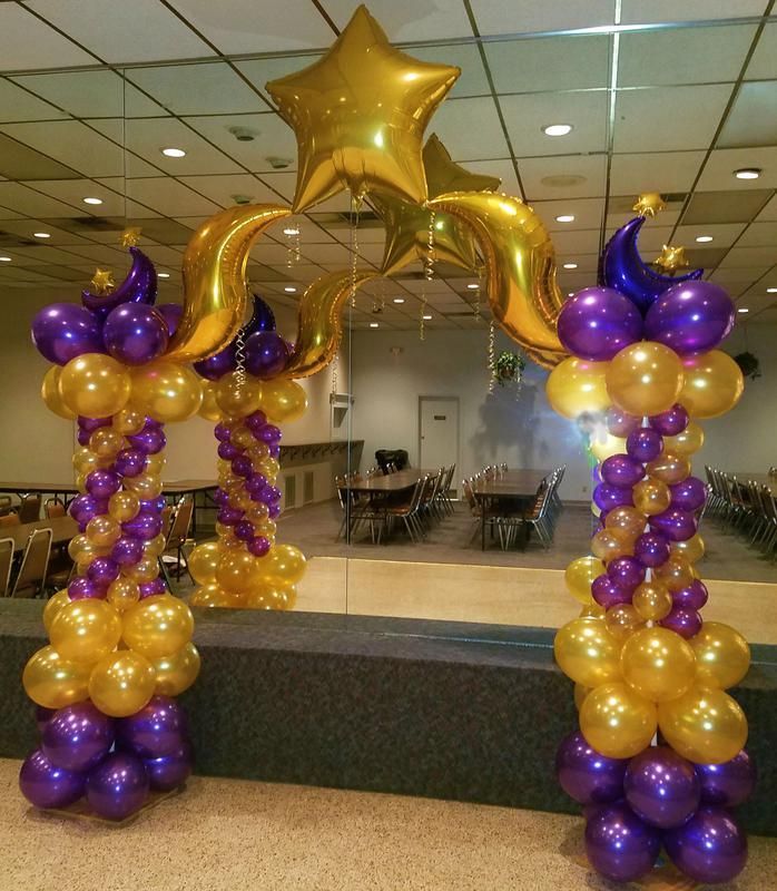 Purple and gold balloons are stacked on top of each other