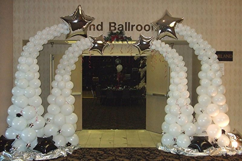 White balloons are lined up in front of a sign that says 2nd ballroom