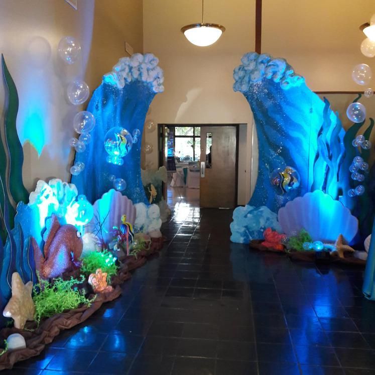 A hallway decorated with sea creatures and waves