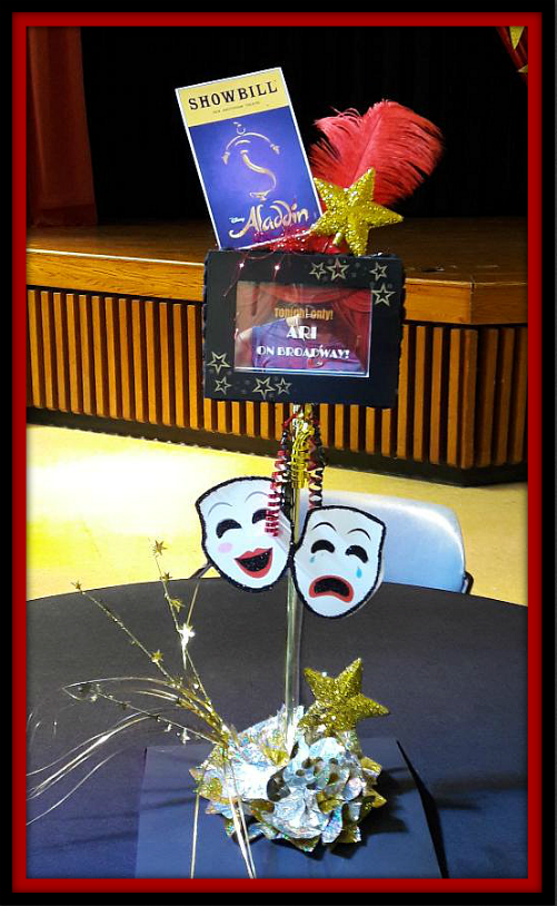 A table with a sign that says ' aladdin ' on it