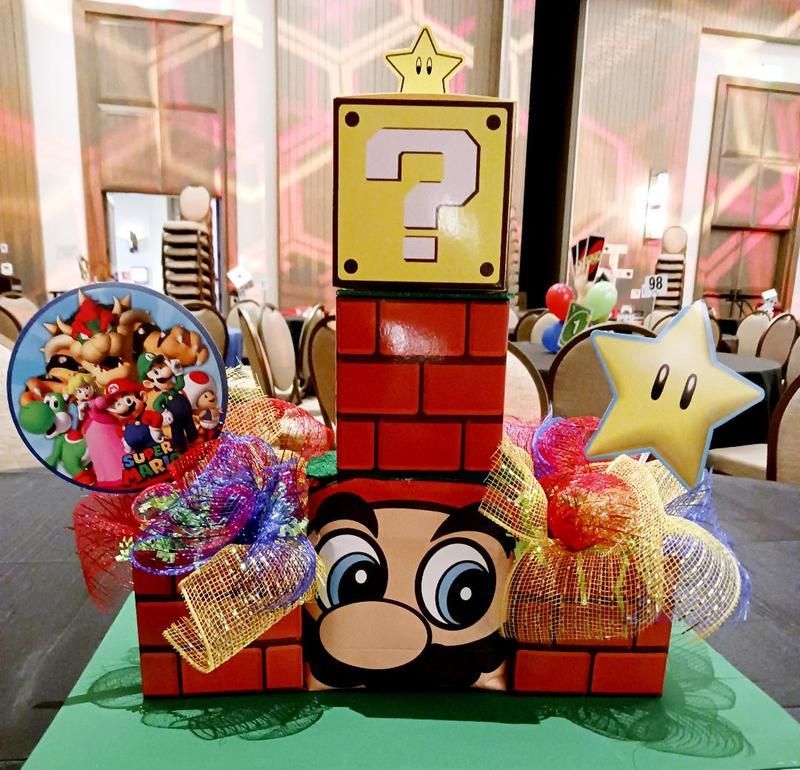 A brick tower with a question mark on top of it