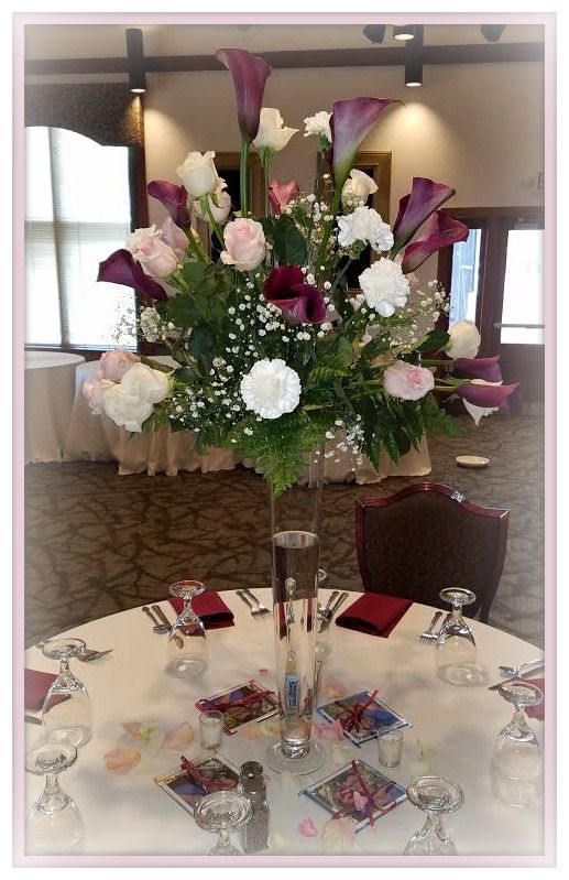 A table with a vase of flowers on it