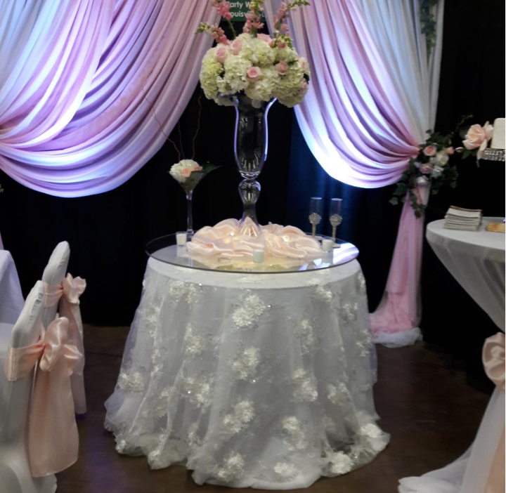 A table with a vase of flowers on it