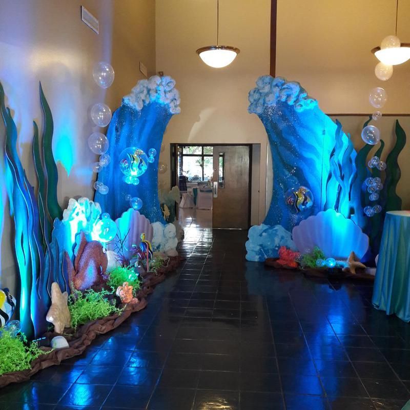 A hallway decorated with sea creatures and waves