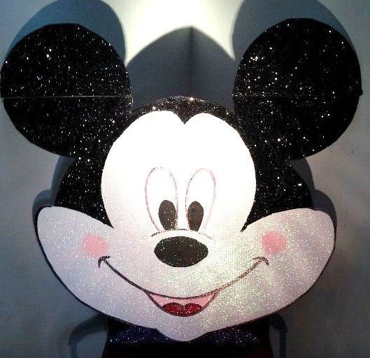A close up of a mickey mouse head with black ears