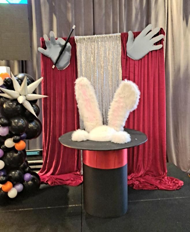A table with a top hat and bunny ears on it