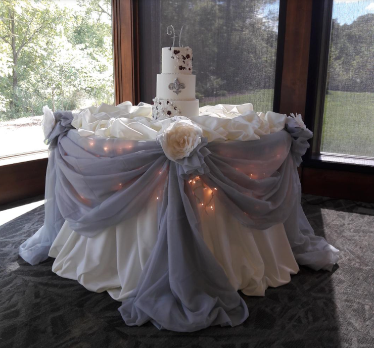 A wedding cake sitting on top of a table