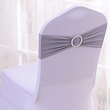 A white chair with a gray sash and a rhinestone buckle.