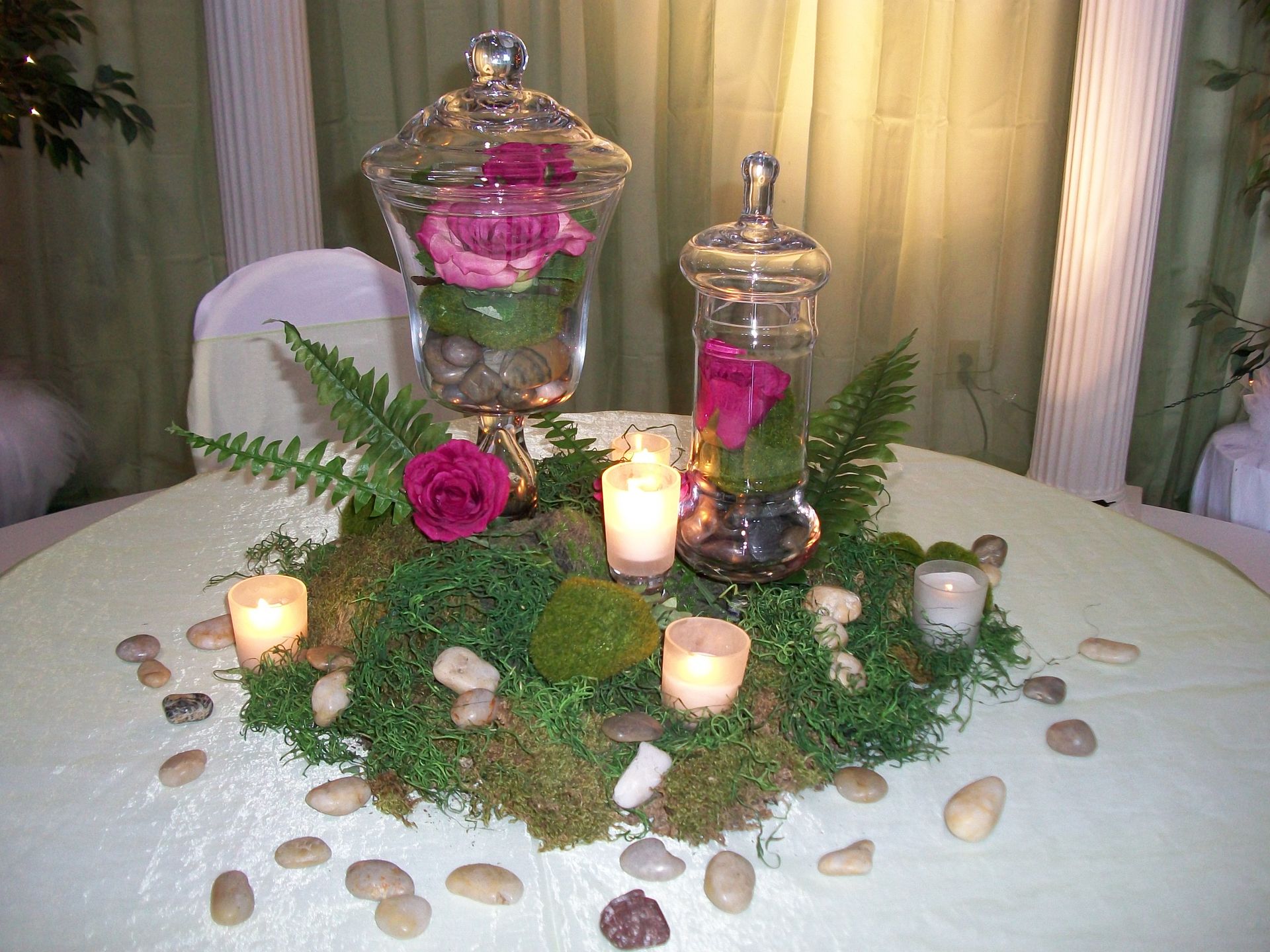 A table with flowers and candles on it