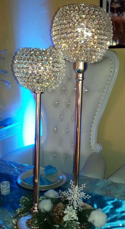 A couple of candle holders sitting on top of a table.