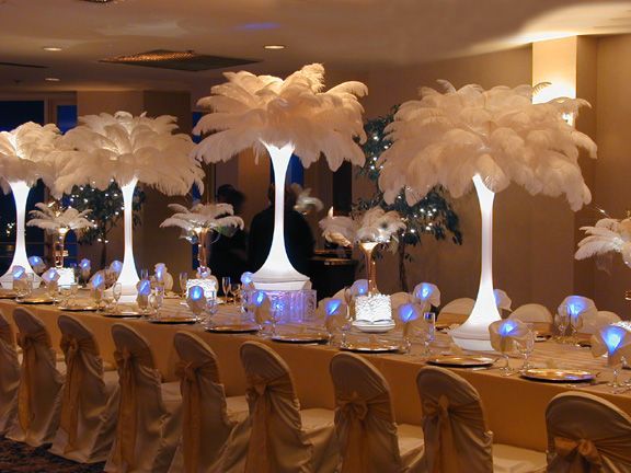 A long table with a lot of white feathers on it