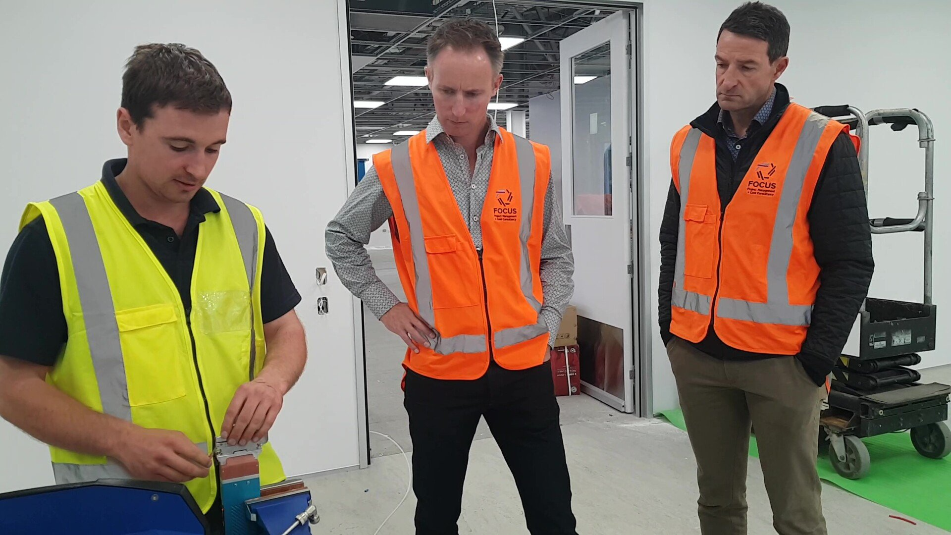 Syft Technologies Engineer Frazer Attrill discusses Syft Technologies designs with Focus Project Services co-directors Nathan Lang and Darryn Crawford 