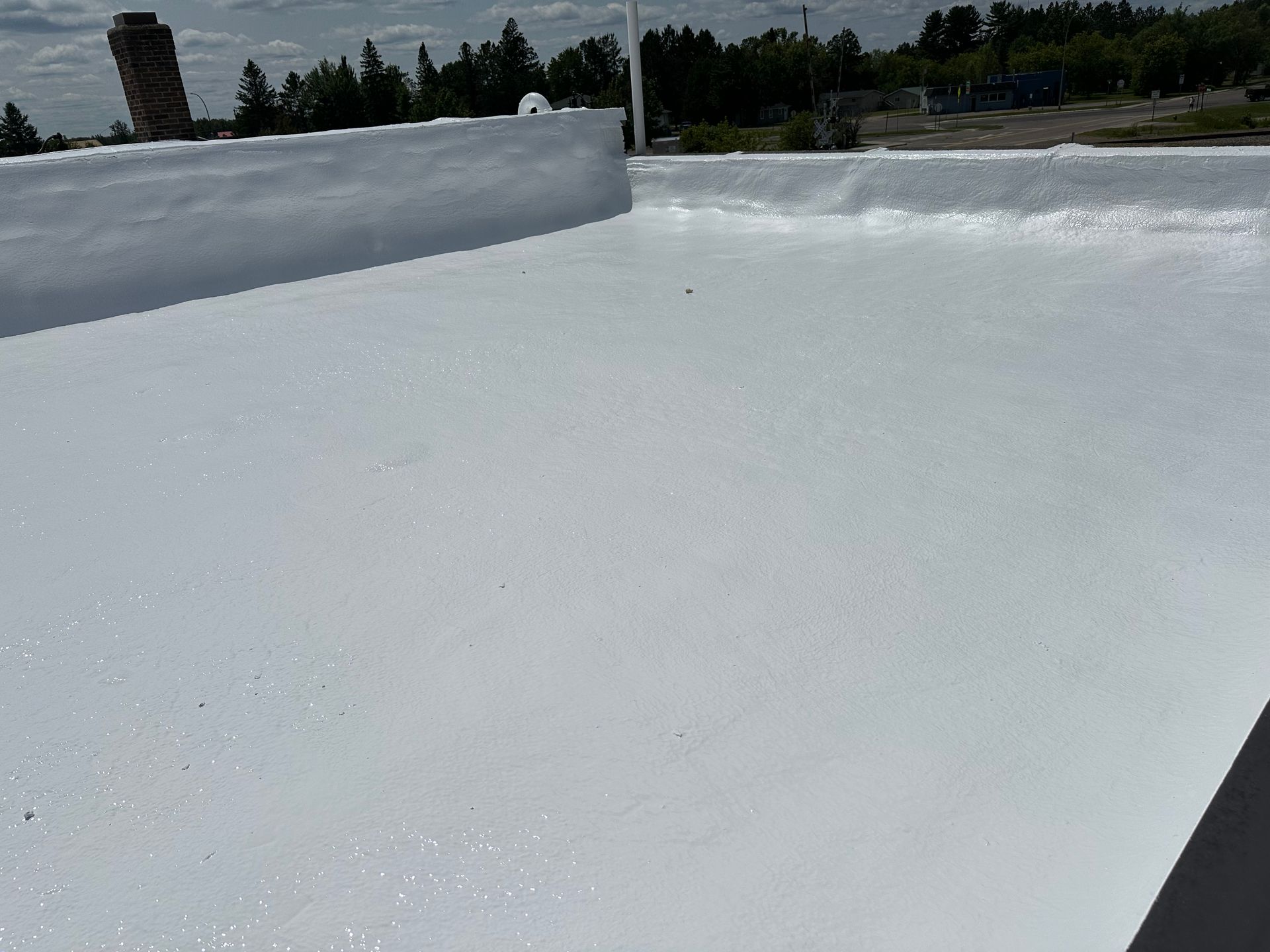 White, flat rooftop on a sunny day.