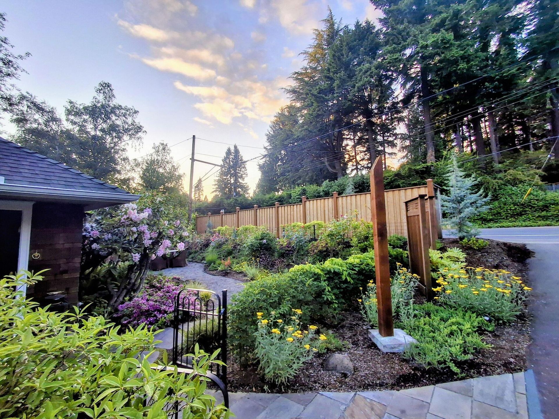 There is a pergola in the backyard of a house in Monroe, WA.