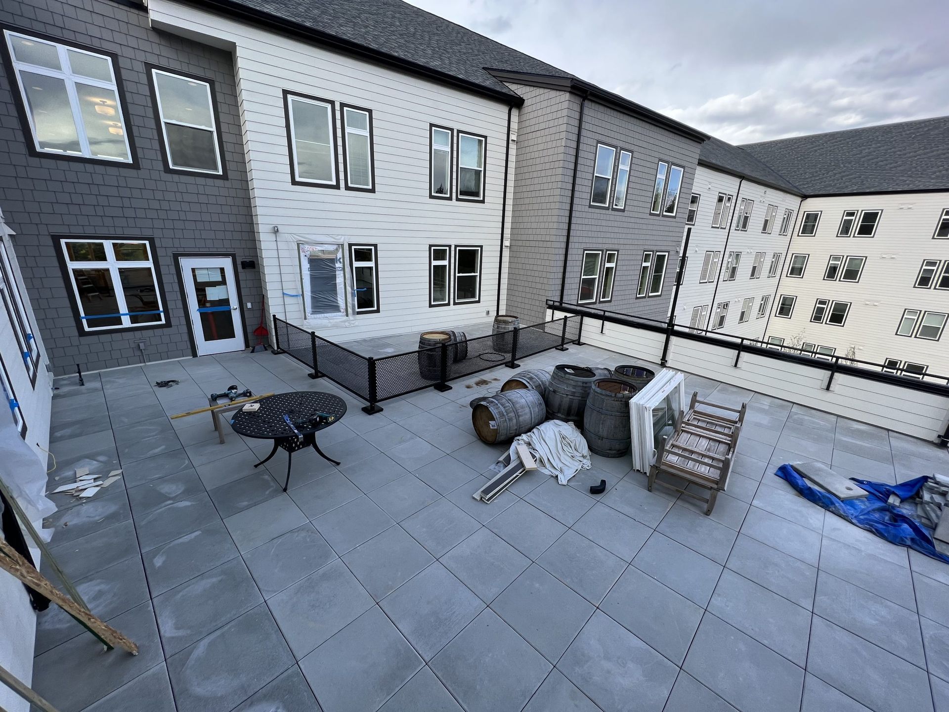 A large building with a patio in front of it.