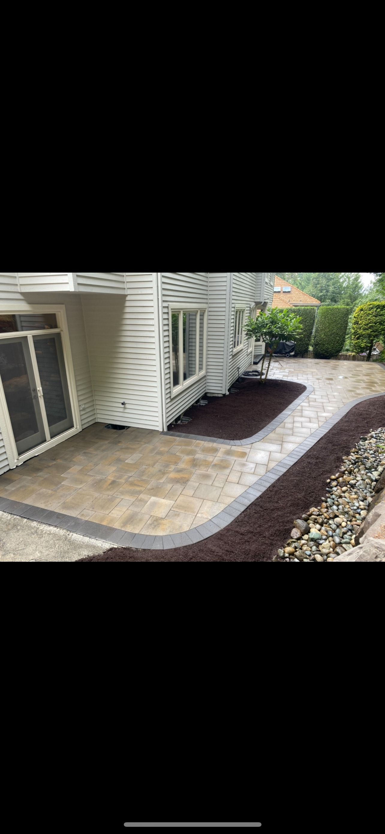 A white house with a patio in front of it in Monroe, WA.