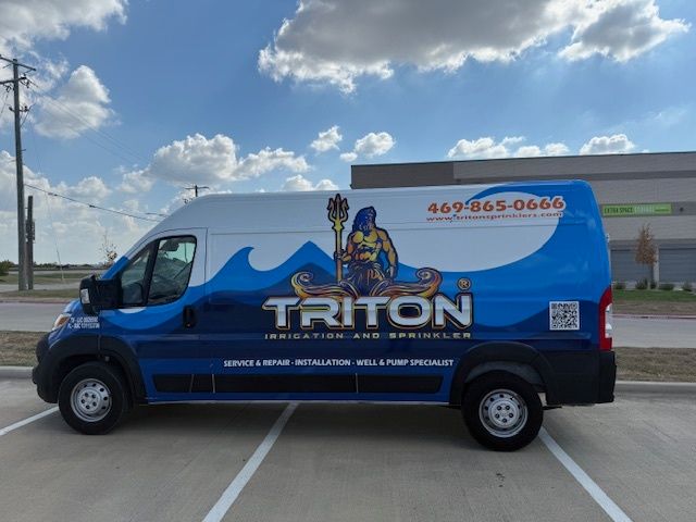 Blue and white Triton Irrigation service van parked in a lot, with logo of a trident-wielding figure.