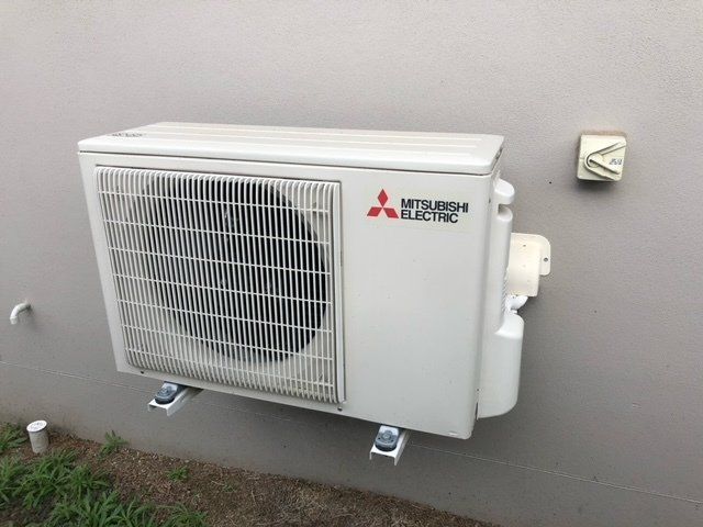Air Conditioning Unit Outside on Wall - Air Conditioning Services in Mackay, QLD