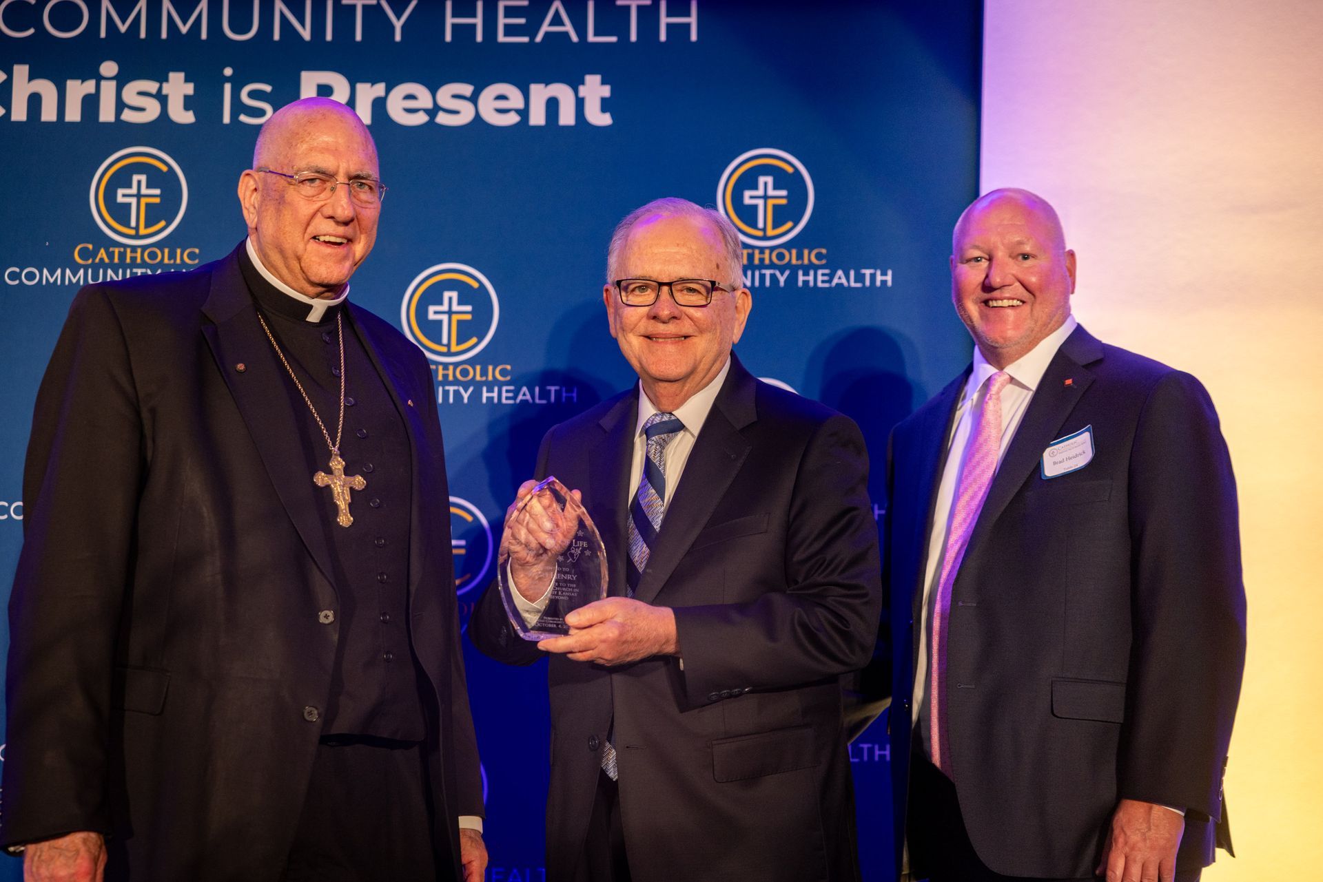 2025 Catholic Community Health Fall Ball - Archbishop Naumann and Brad Heidrick present the Sanctity of Life Award to Rich Henry