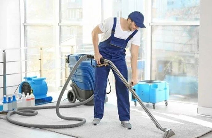 man cleaning carpet