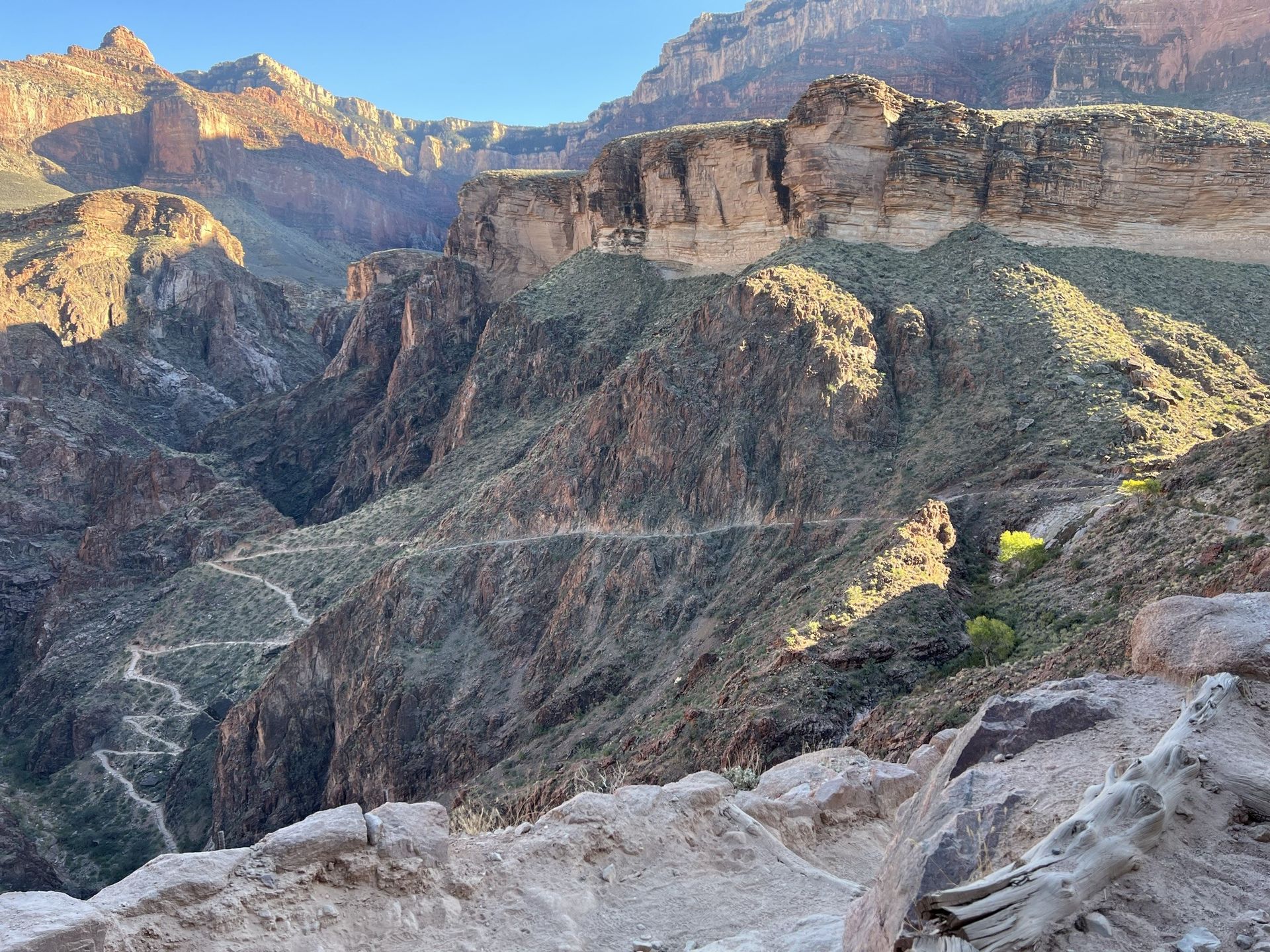 A view of a canyon from the top of a mountain.