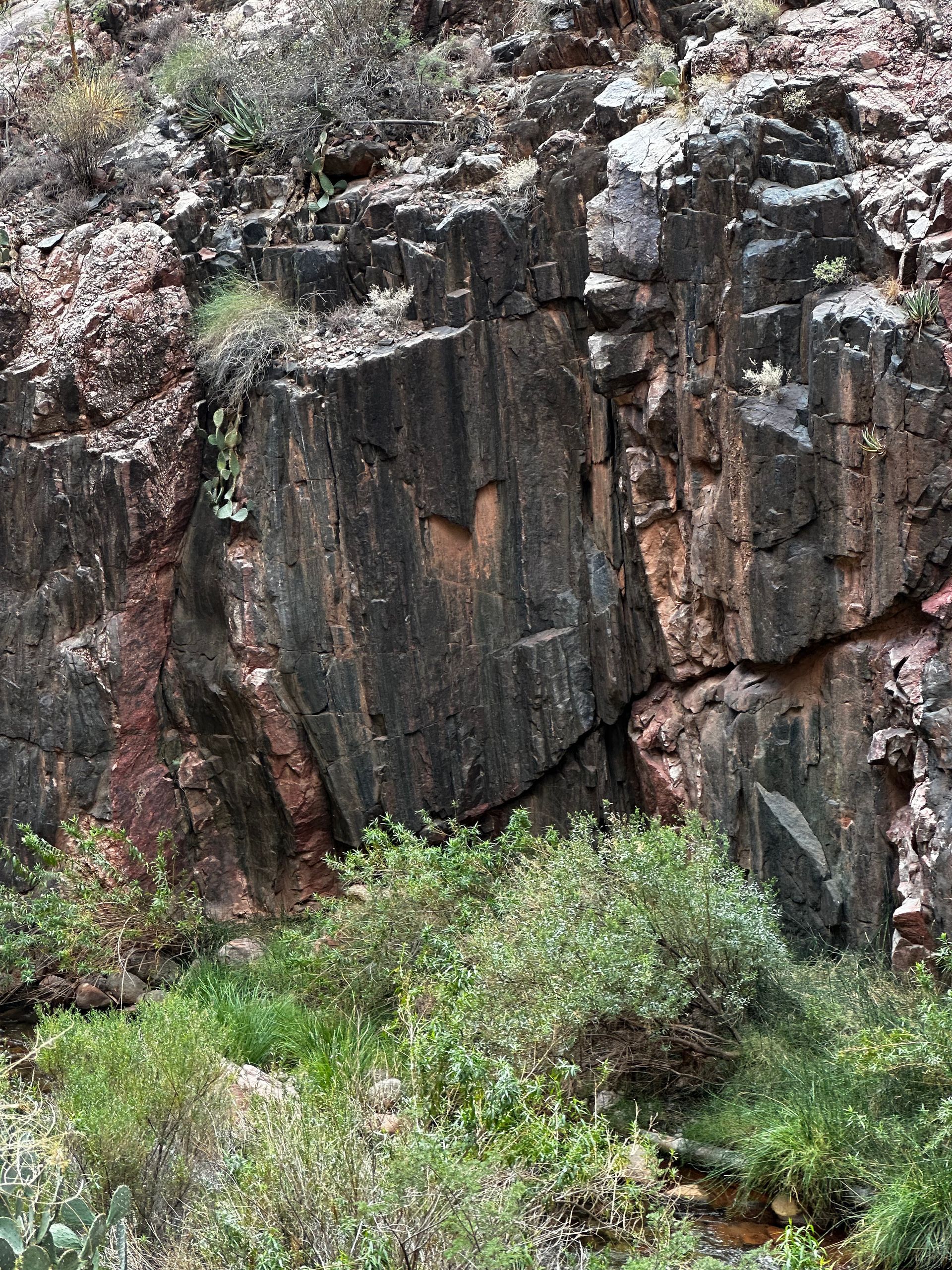 A large rock formation with a heart carved into it