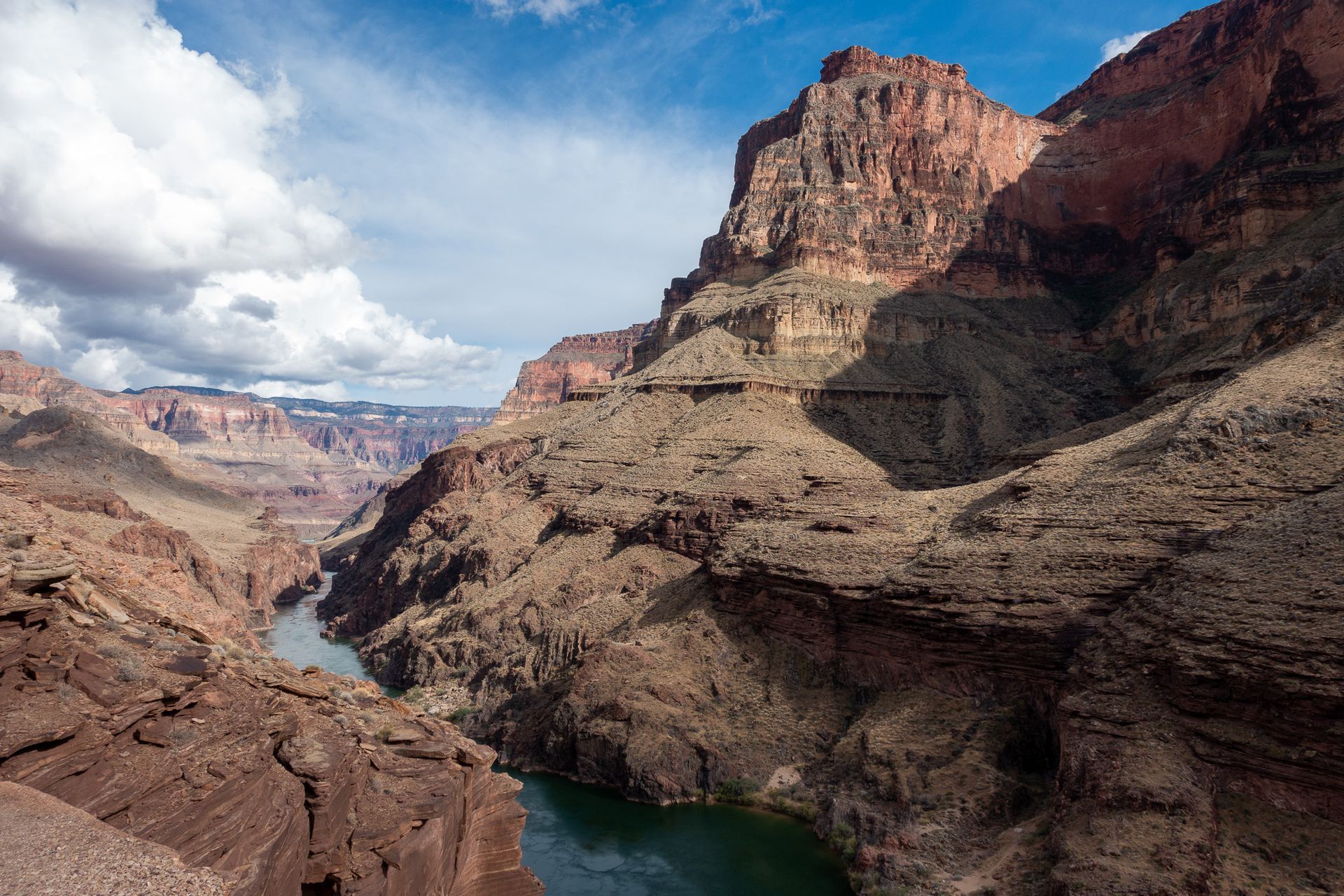 A river runs through a canyon between two mountains.