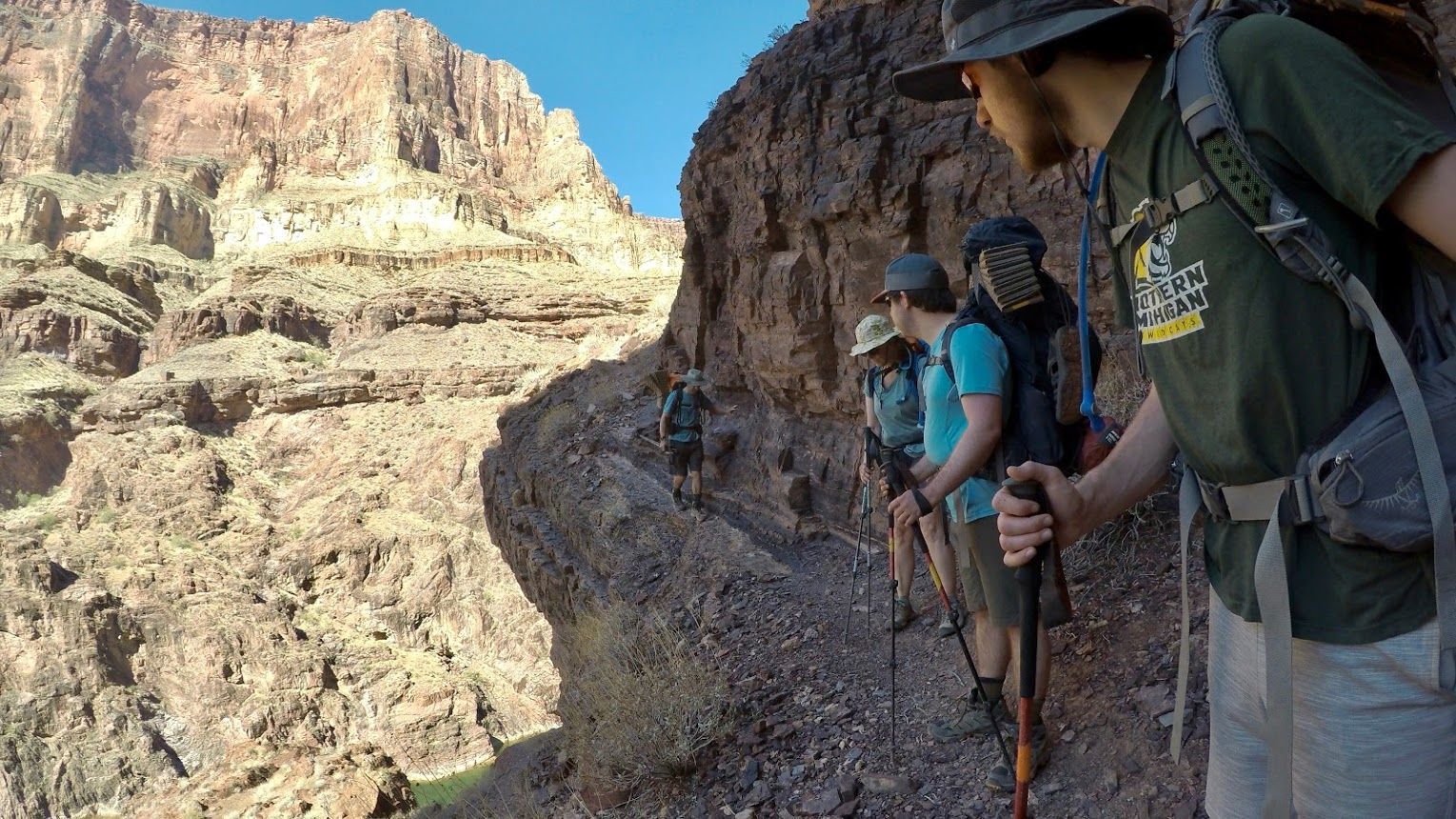 A group of people are hiking up a mountain.