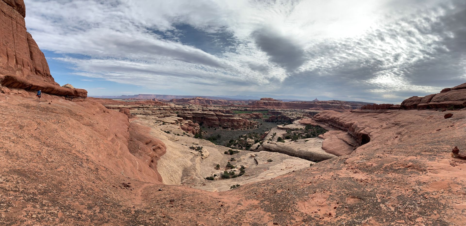 A view of a canyon from the top of a rock formation.