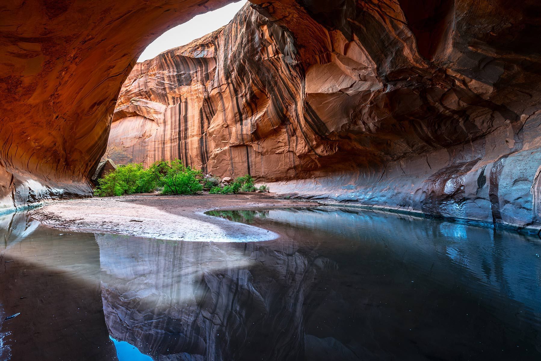 There is a large body of water in the middle of a cave.