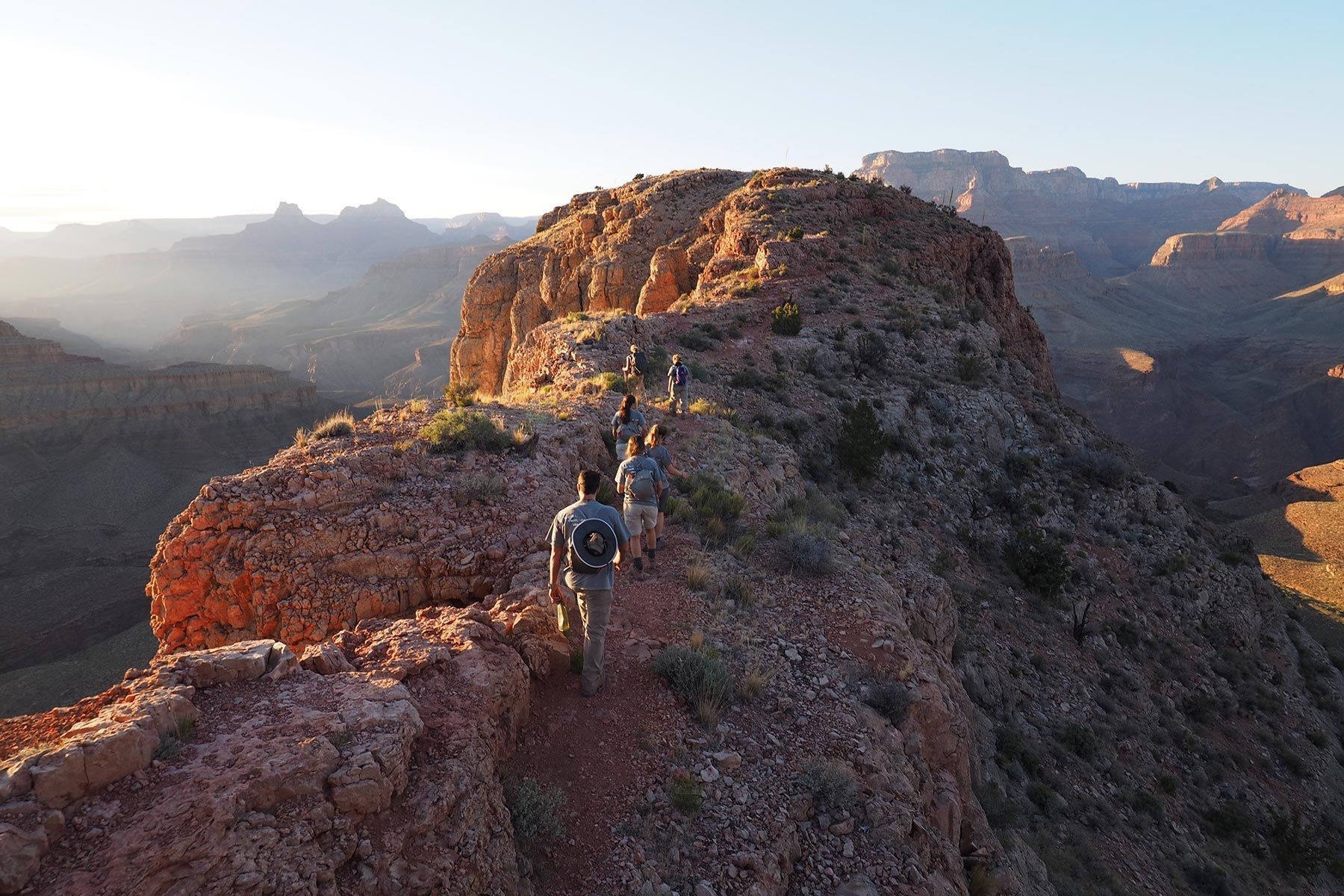 A group of people are hiking up a mountain.