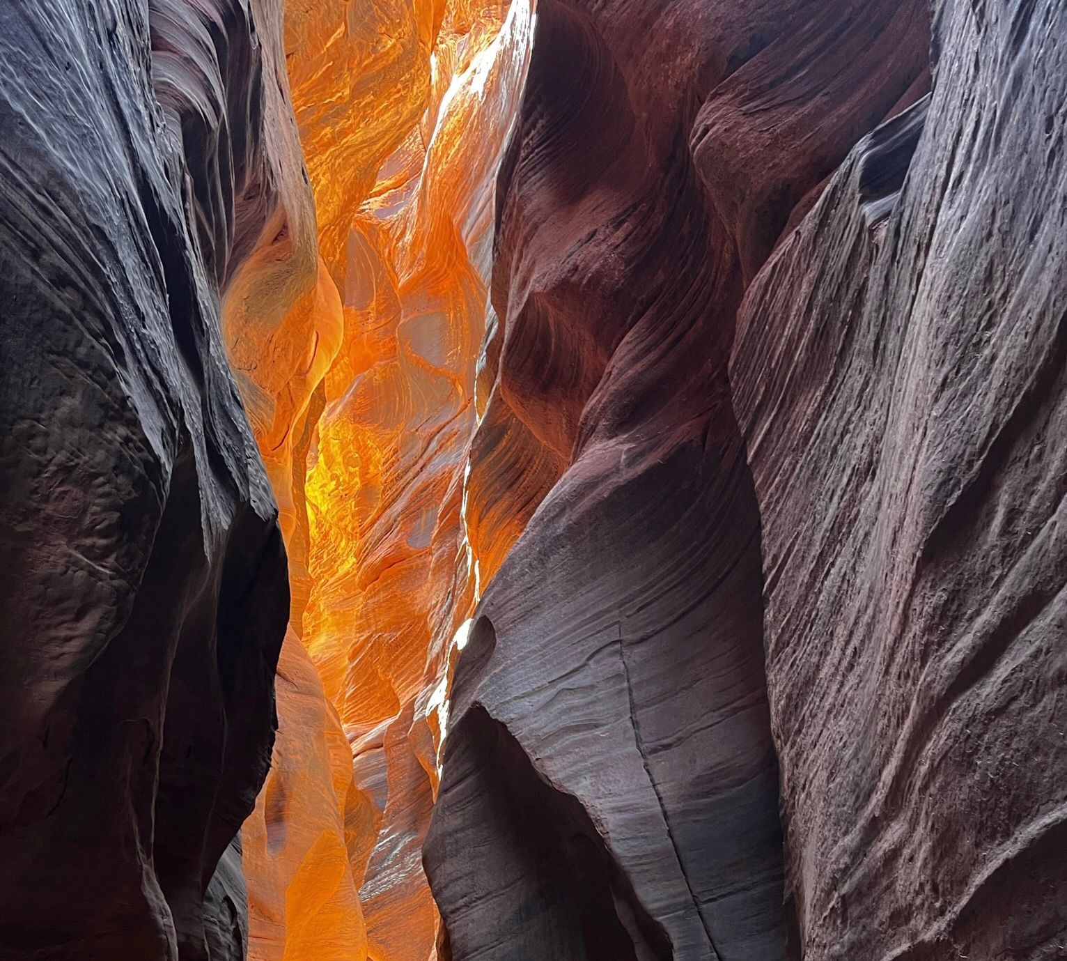A canyon with a lot of rocks and a fire coming out of it