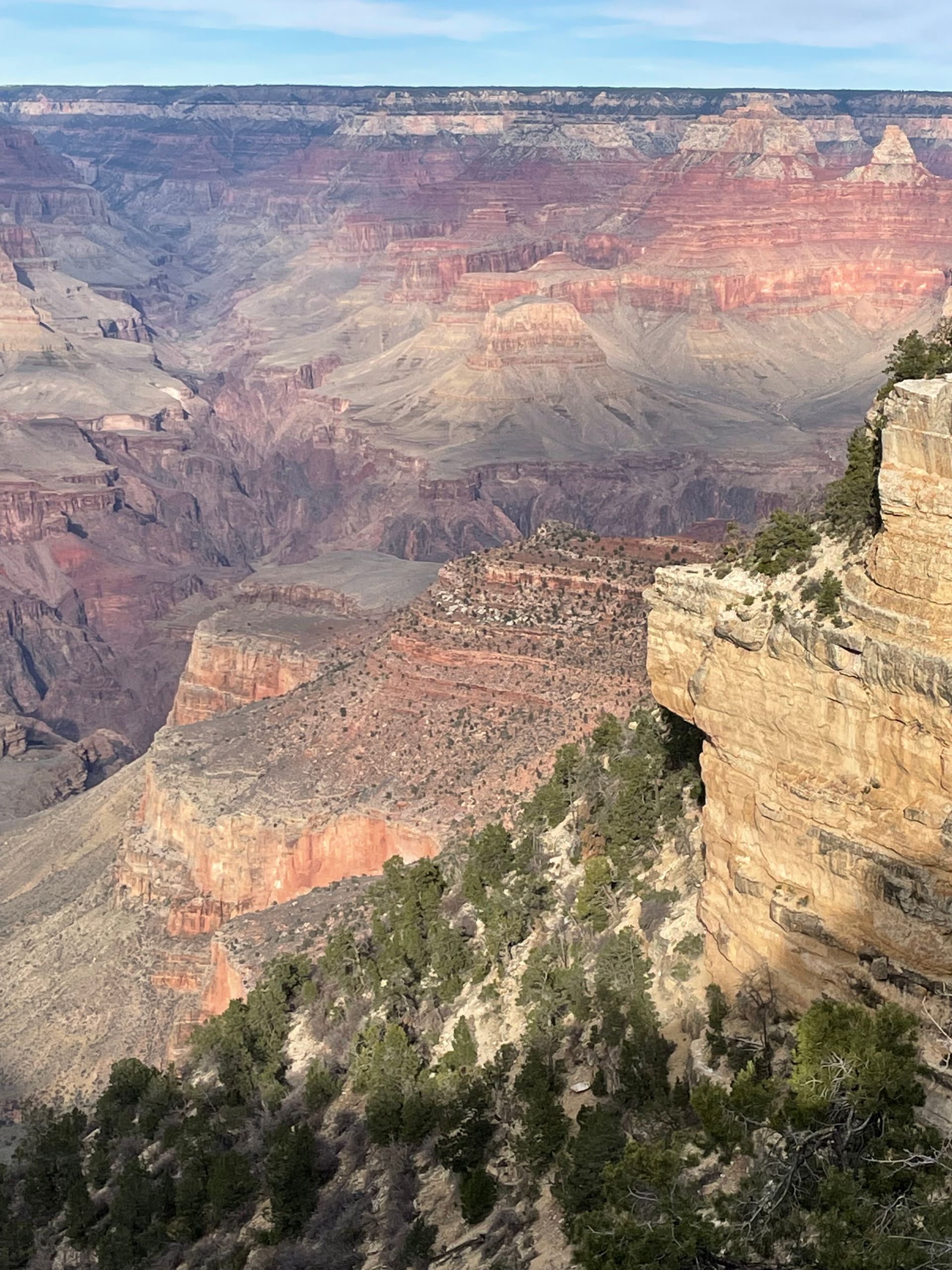 A view of the grand canyon from the edge of a cliff.