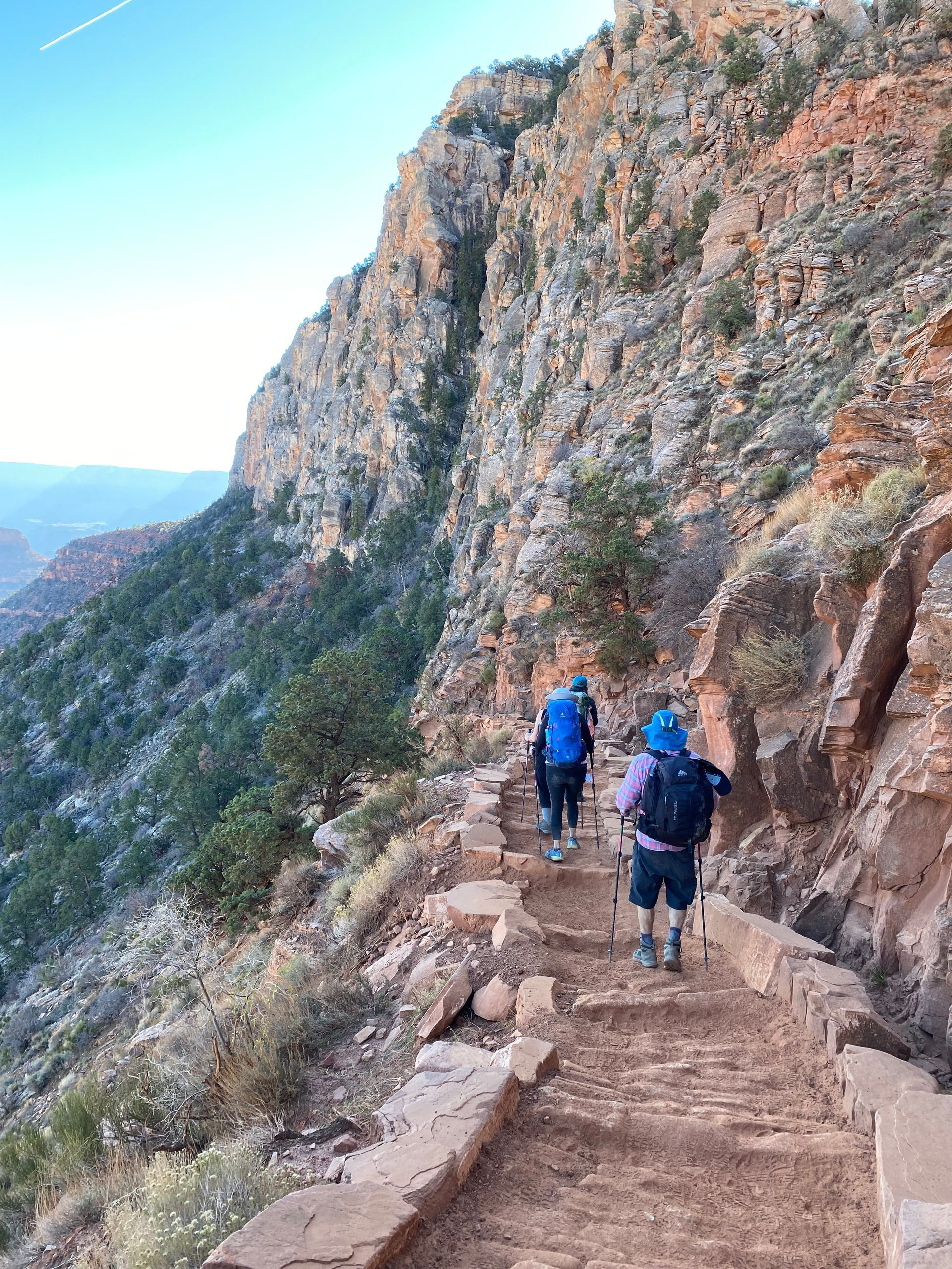 A group of people are hiking up a mountain.