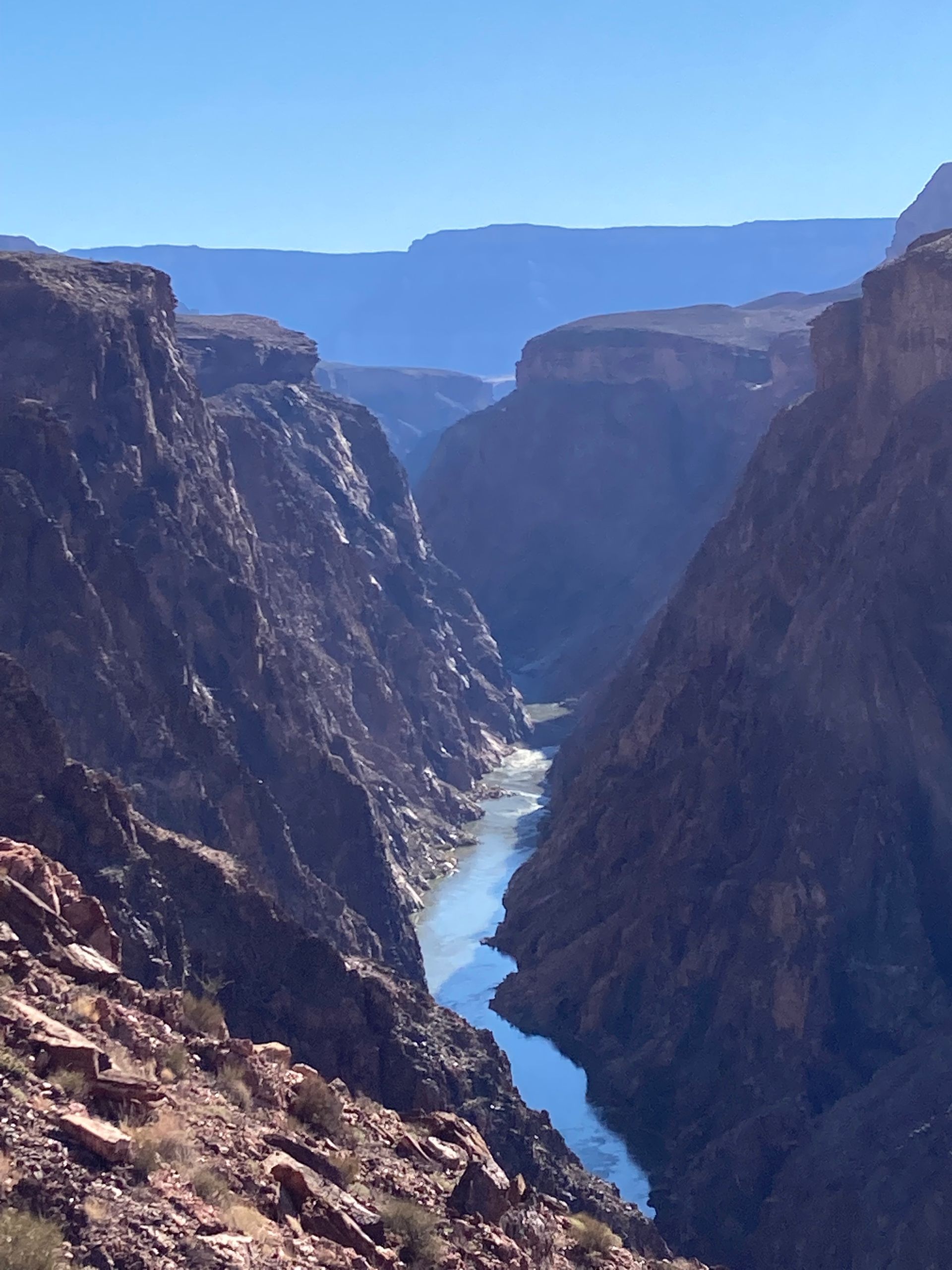 A river runs through a canyon between two mountains