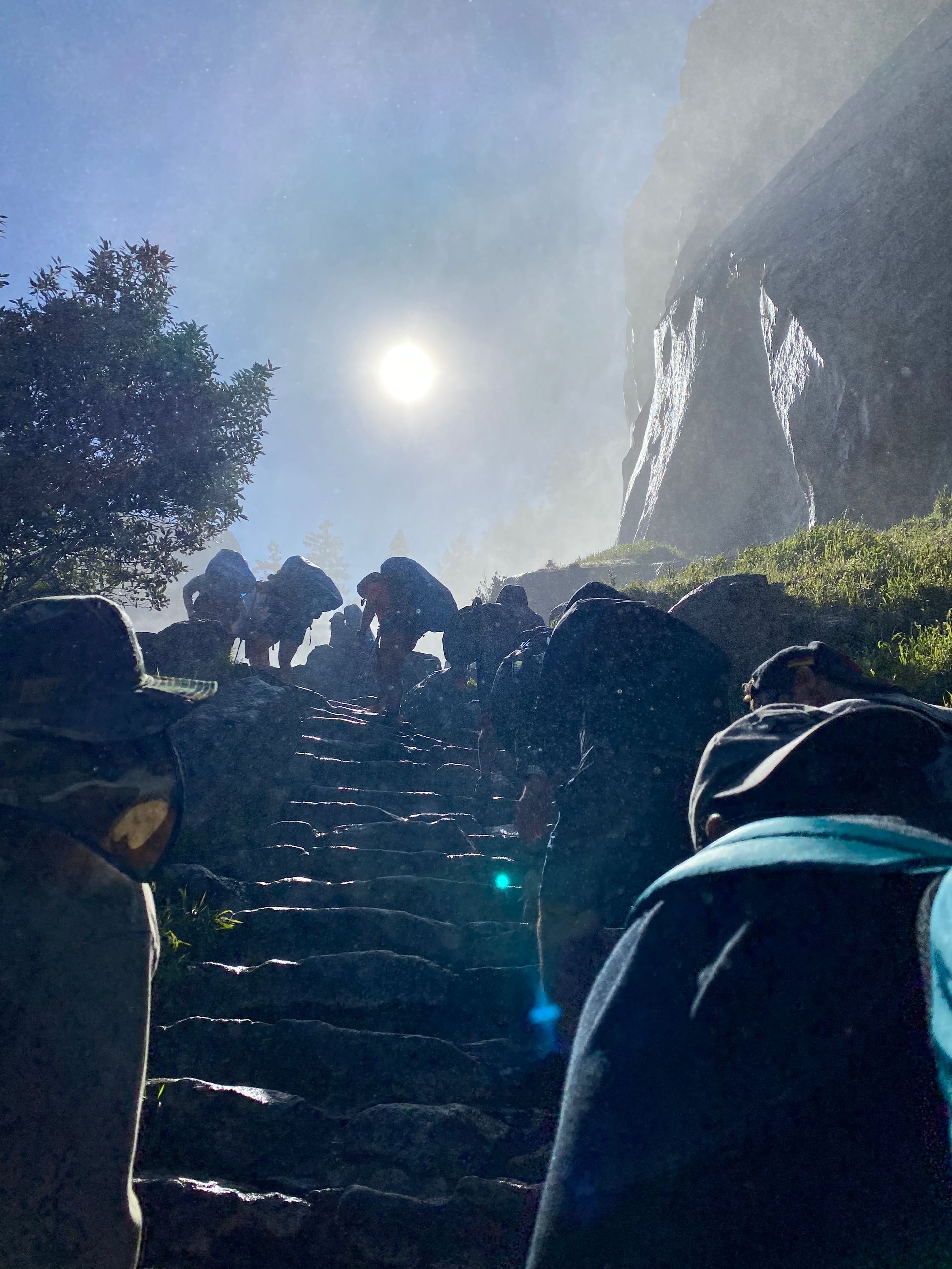 A group of people are walking up a set of stairs.
