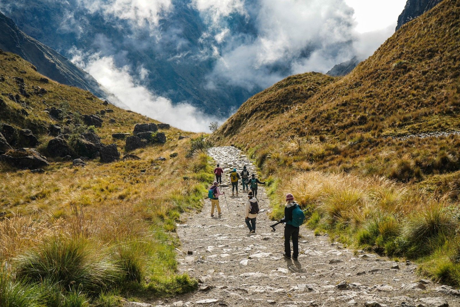 Machu Picchu, Peru, with terraced fields and stone buildings on a mountainside.