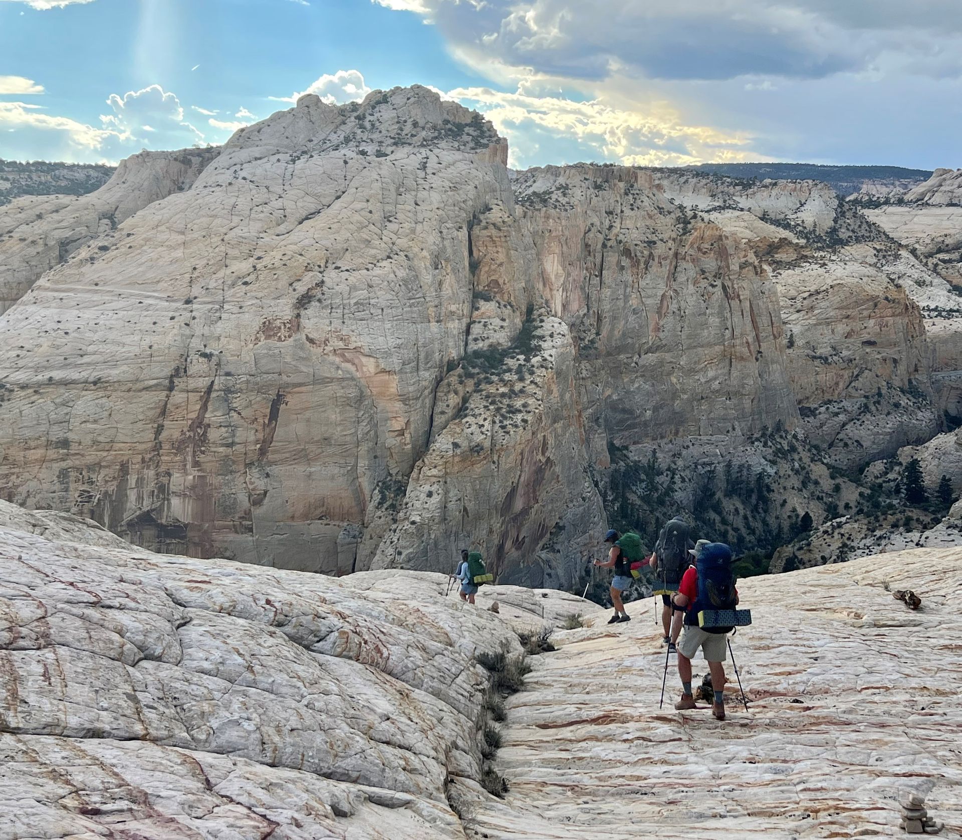 A group of people are hiking up a mountain.