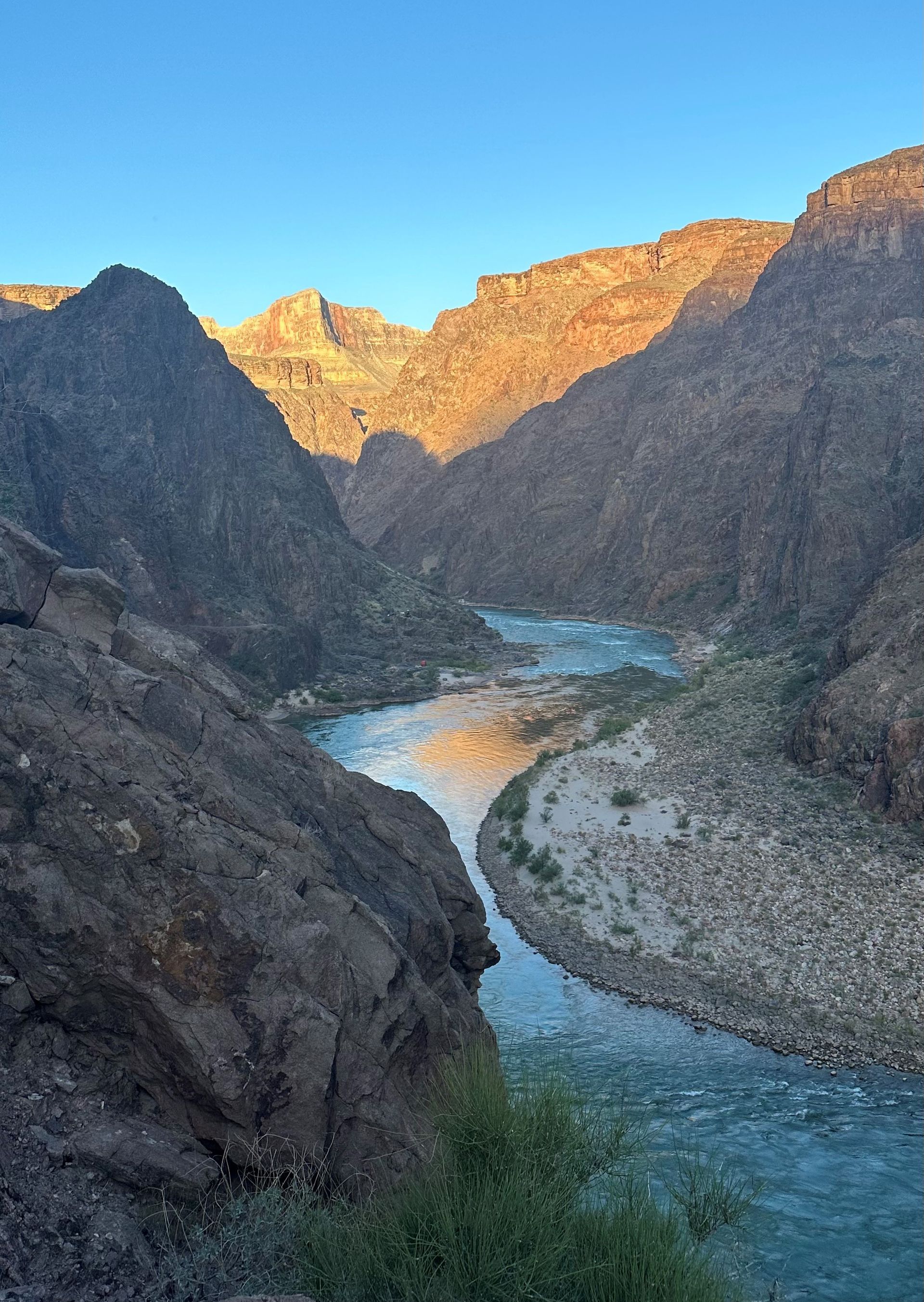 A river runs through a canyon between two mountains