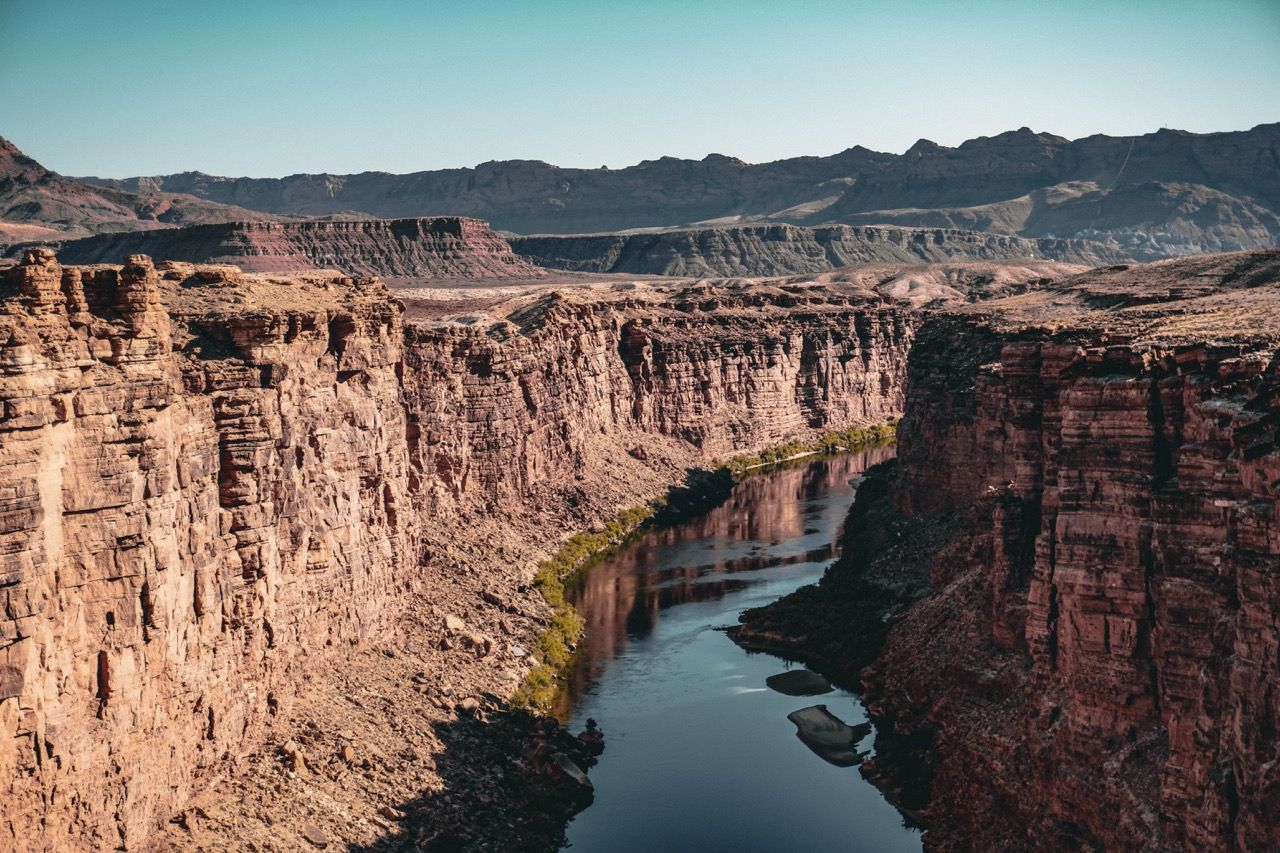 An aerial view of a river flowing through a canyon.