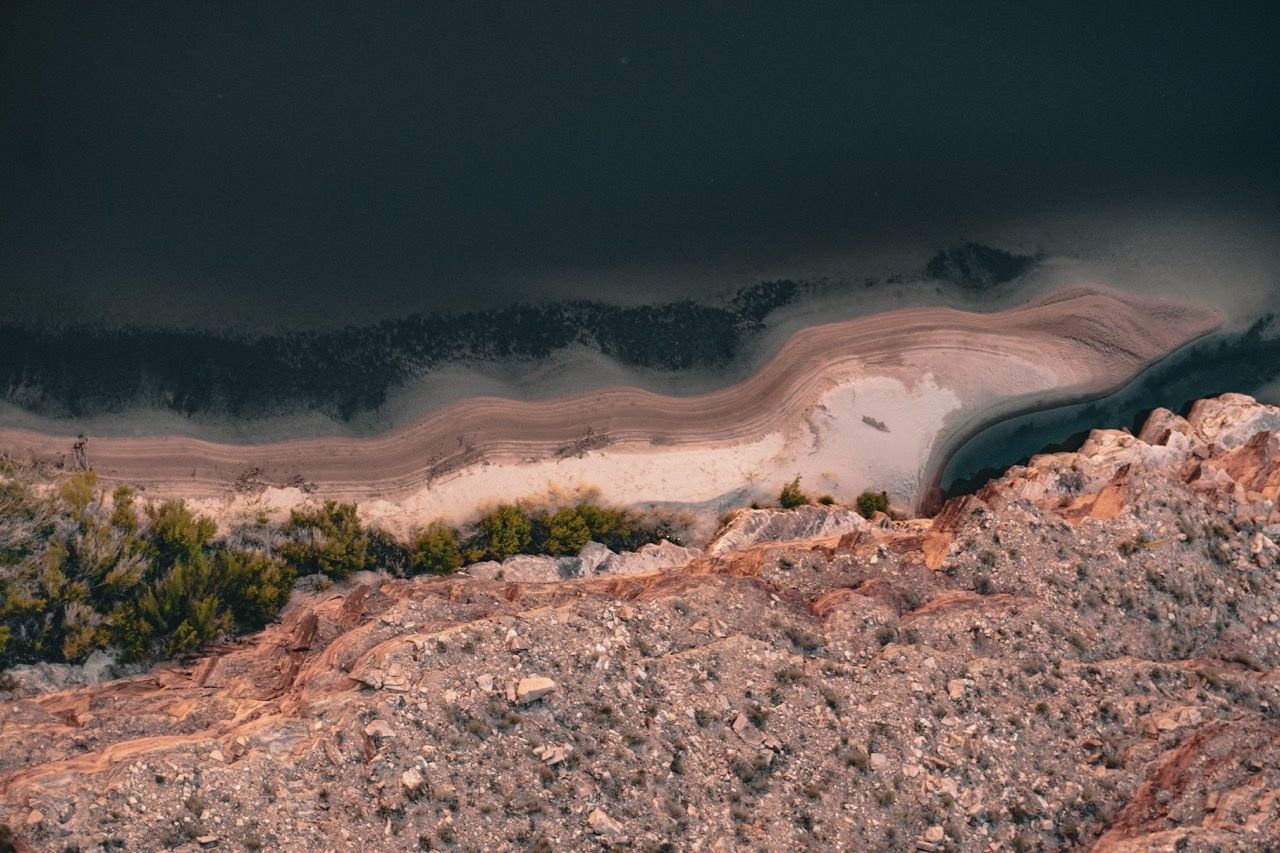 An aerial view of a beach and a body of water.