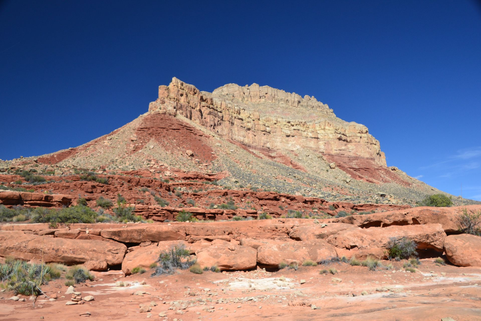 Red rock mesa under a deep blue sky.