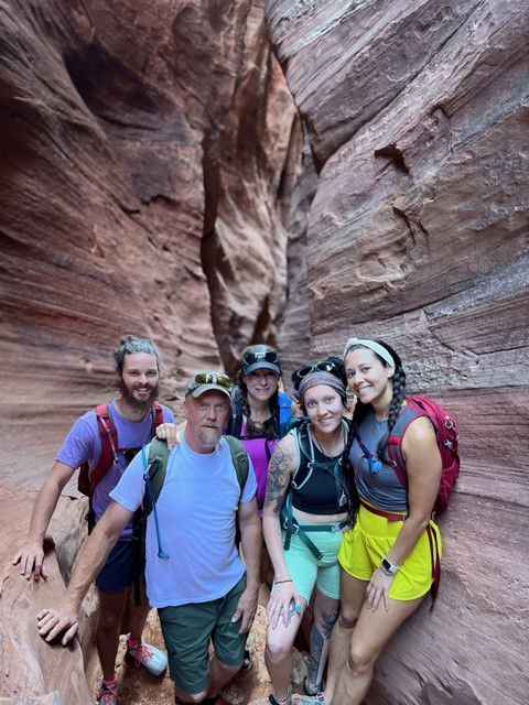 A Group of People Are Hiking Up a Mountain