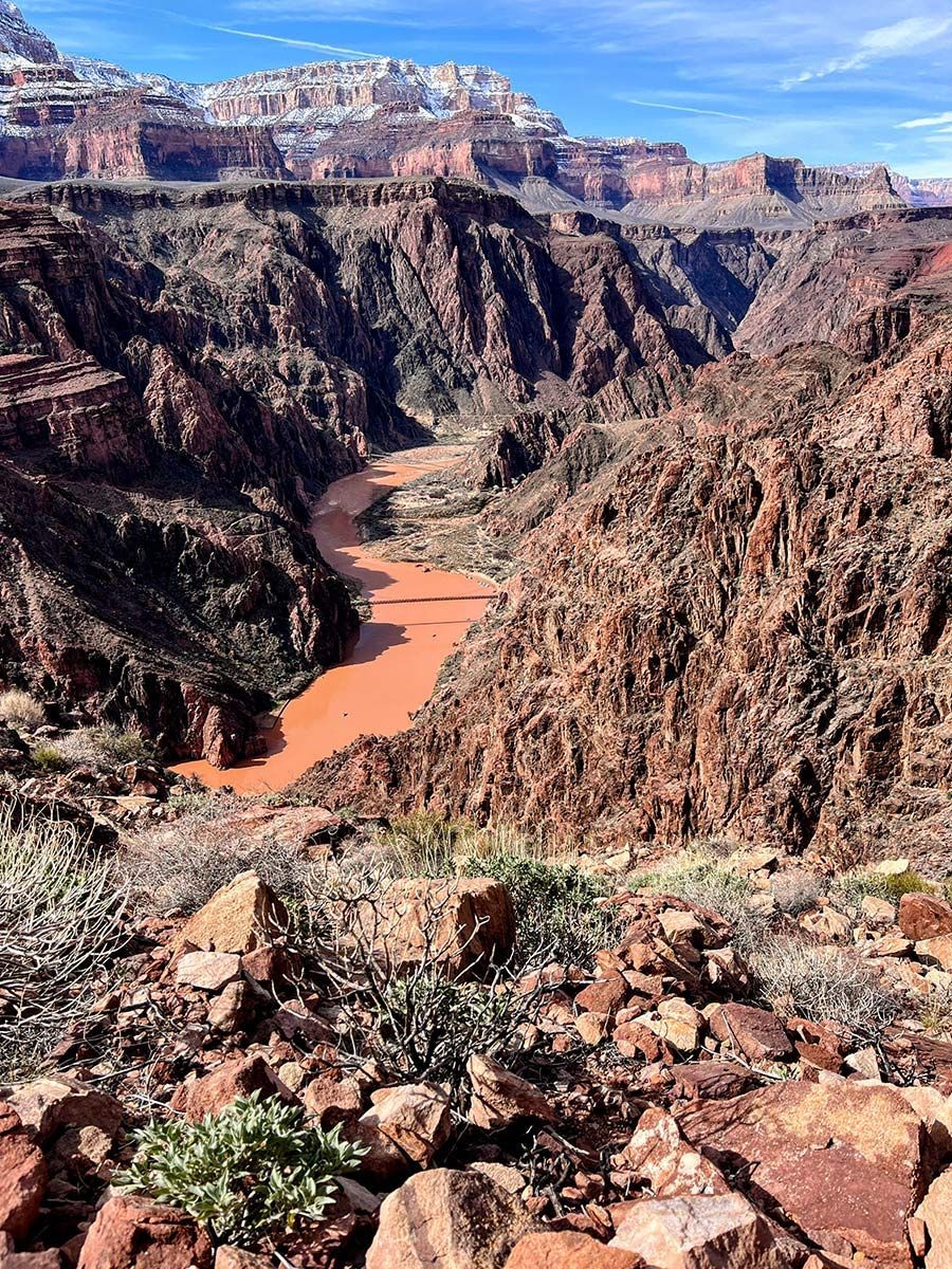 A river running through a canyon surrounded by rocks and mountains.