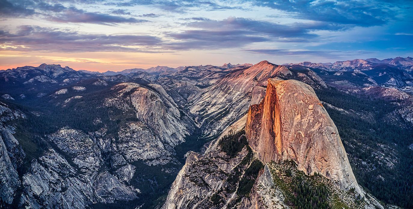 An Aerial View of a Mountain Range at Sunset