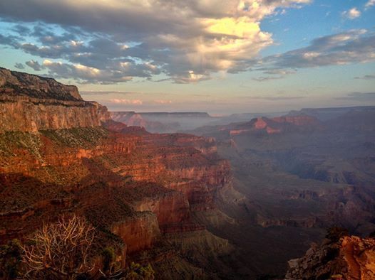 A view of the grand canyon from the rim at sunset.