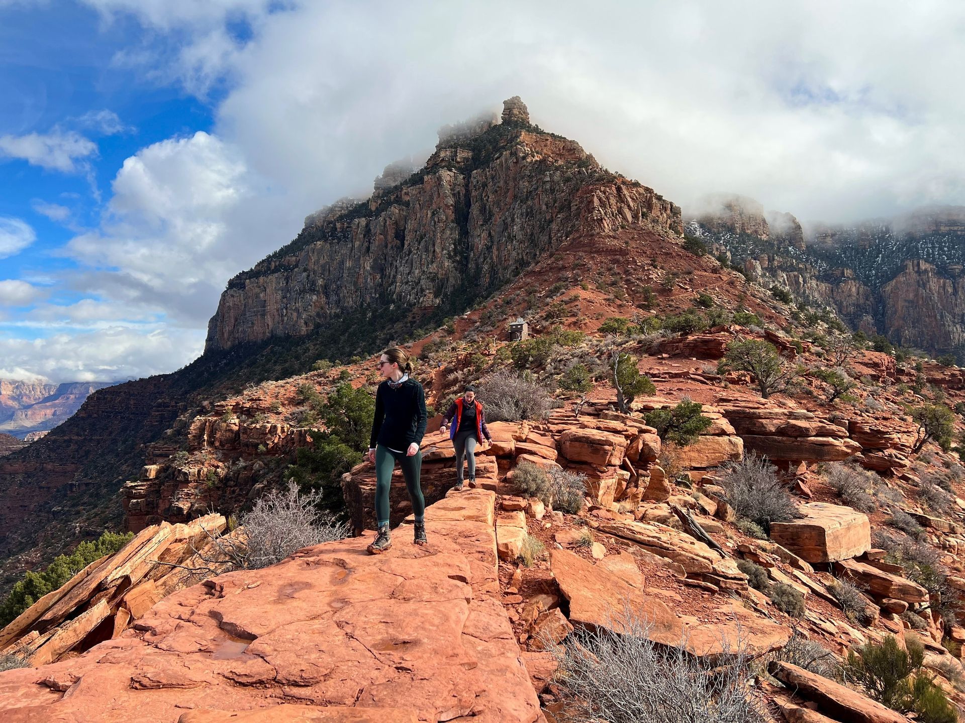 A group of people are hiking up a mountain.