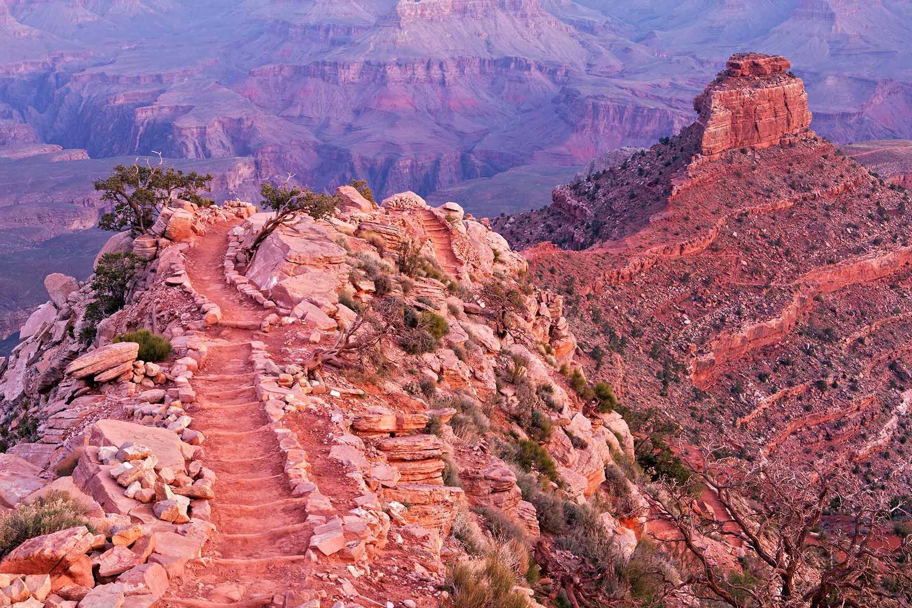 A trail going up the side of a mountain.