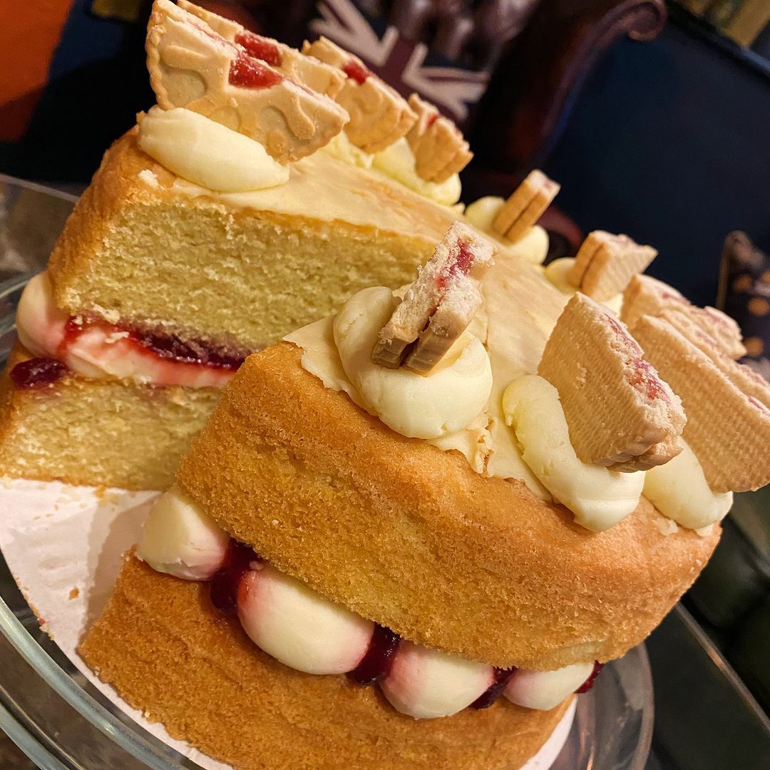 A close up of a cake with a slice missing